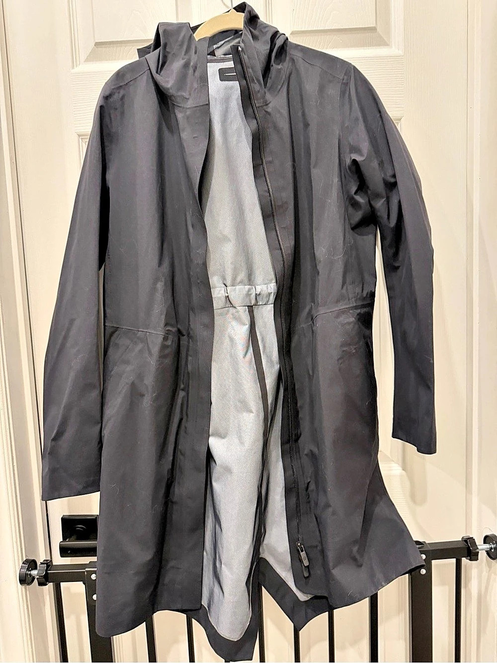 This is the Lululemon Rain Rebel Waterproof Jacket in black. Size 8